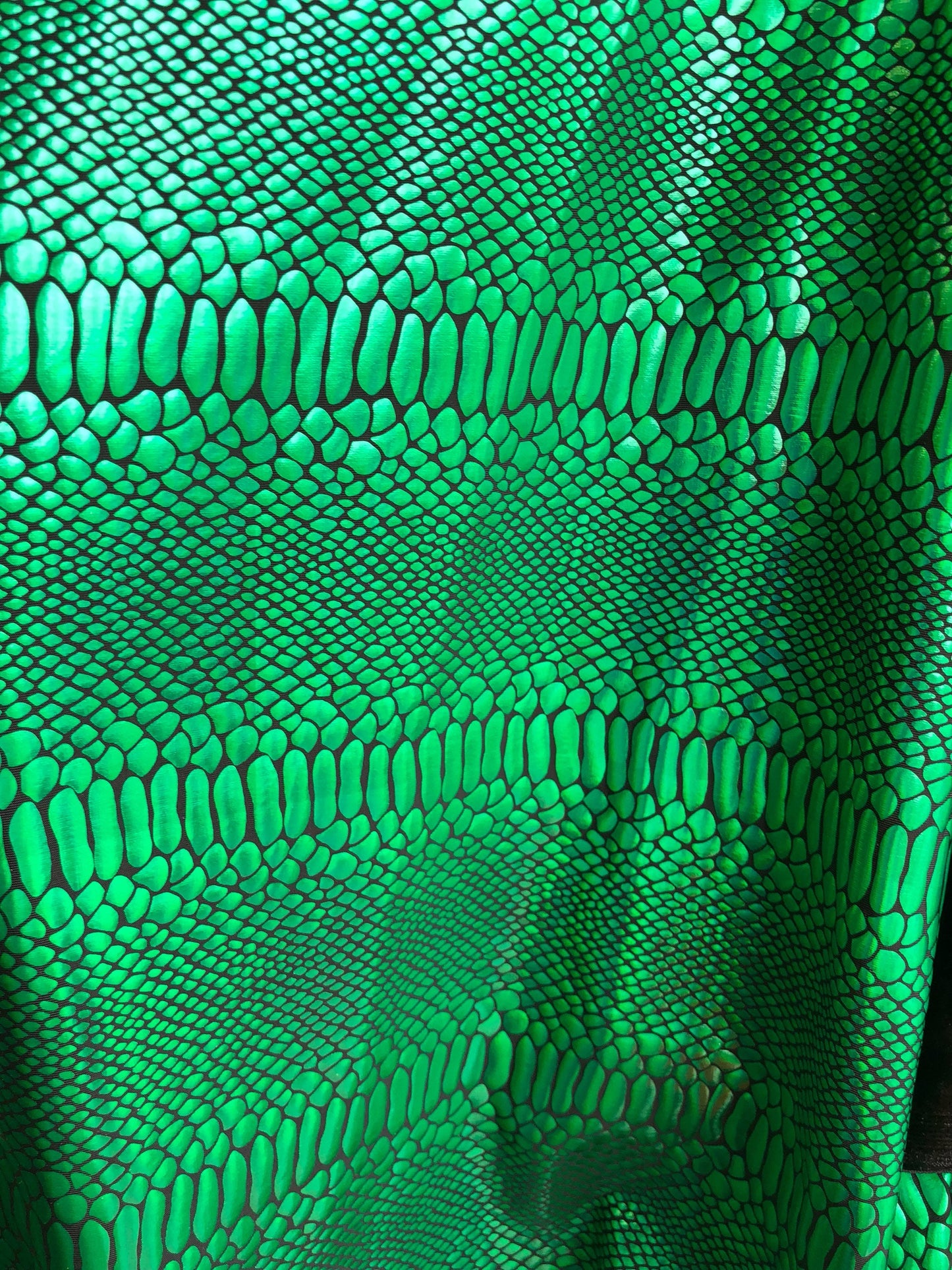 New metallic spandex crocodile design balck/green 4way Stretch 58/60" Sold by the YD. Ships worldwide from Los Angeles California USA.