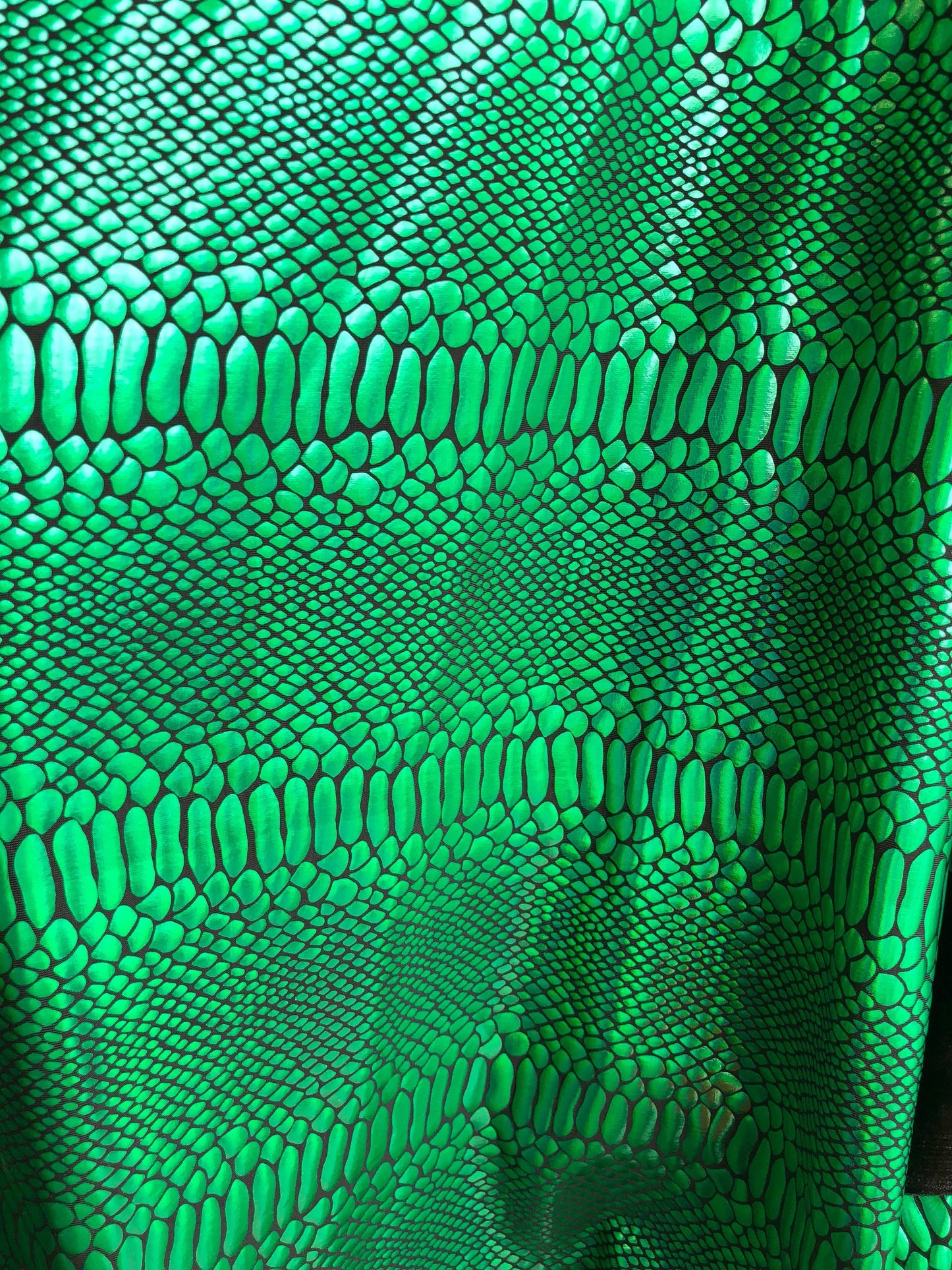 New metallic spandex crocodile design balck/green 4way Stretch 58/60" Sold by the YD. Ships worldwide from Los Angeles California USA.