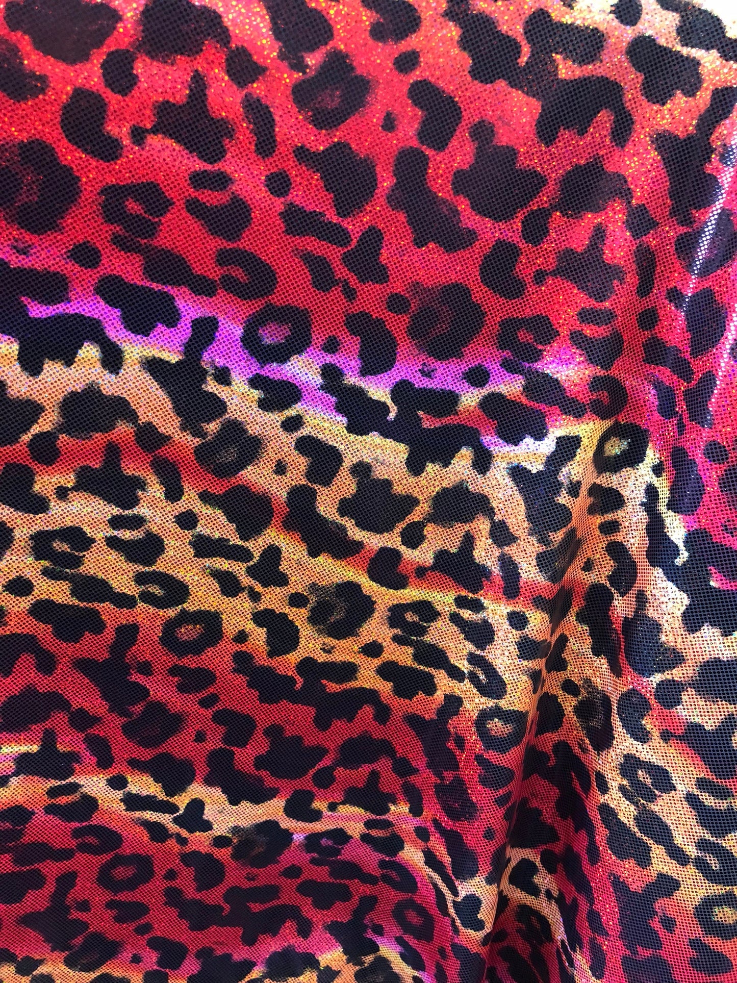 New leopard hologram foil design on nylon spandex 4way Stretch 58/60" Sold by the YD. Ships worldwide from Los Angeles California USA