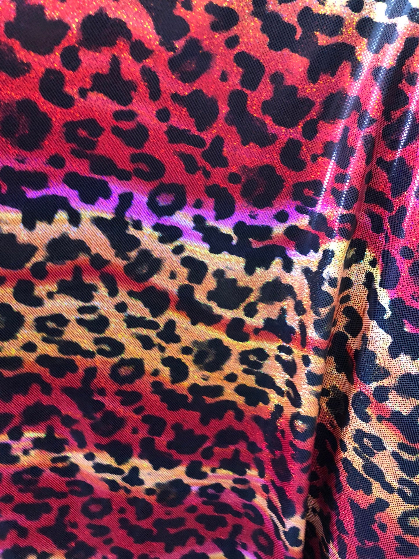 New leopard hologram foil design on nylon spandex 4way Stretch 58/60" Sold by the YD. Ships worldwide from Los Angeles California USA