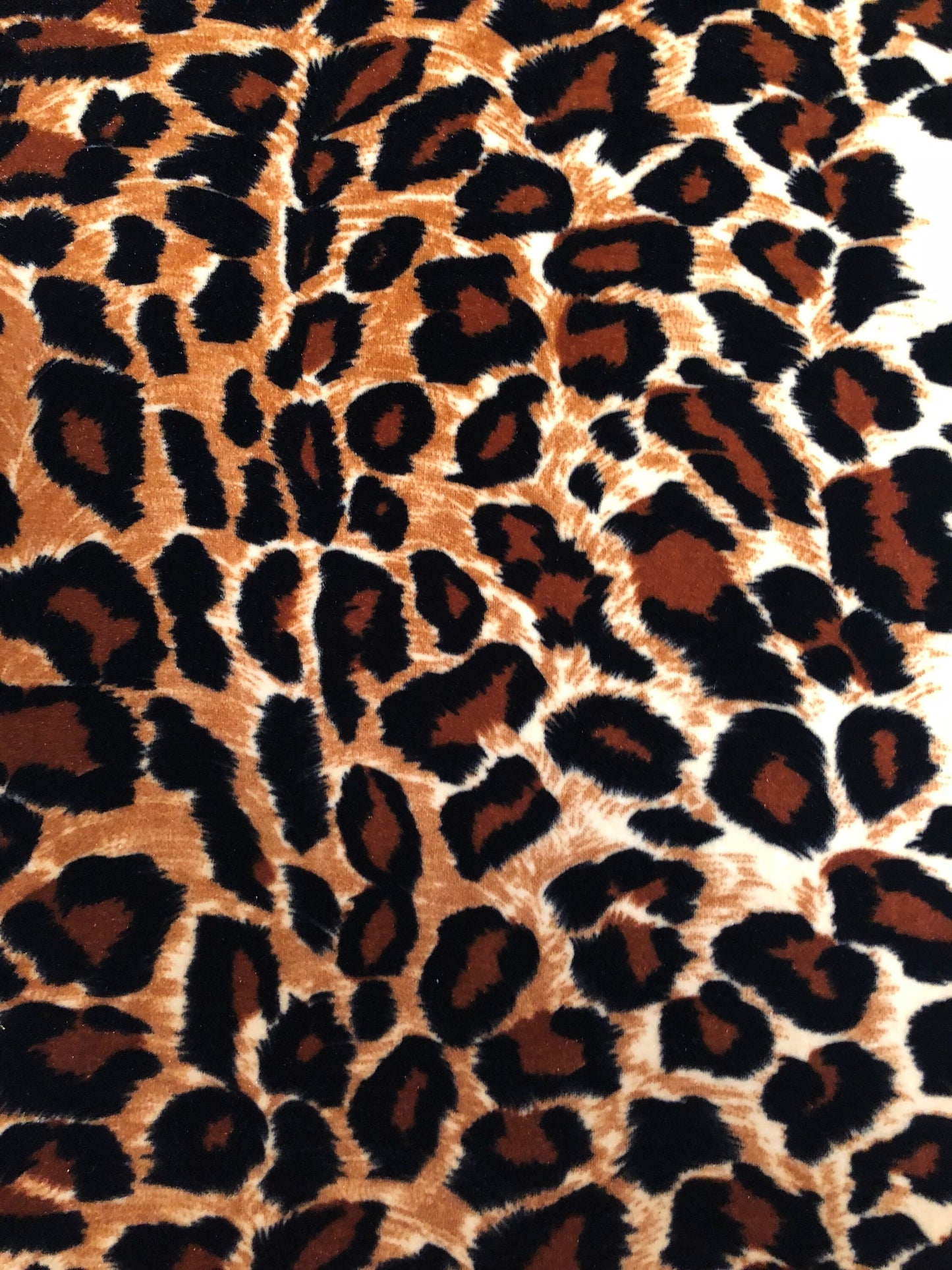 New leopard print Brown/Gold on heavy stretch velvet 4way stretch 58/60" Sold by the YD. Ships worldwide from Los Ángeles California USA.