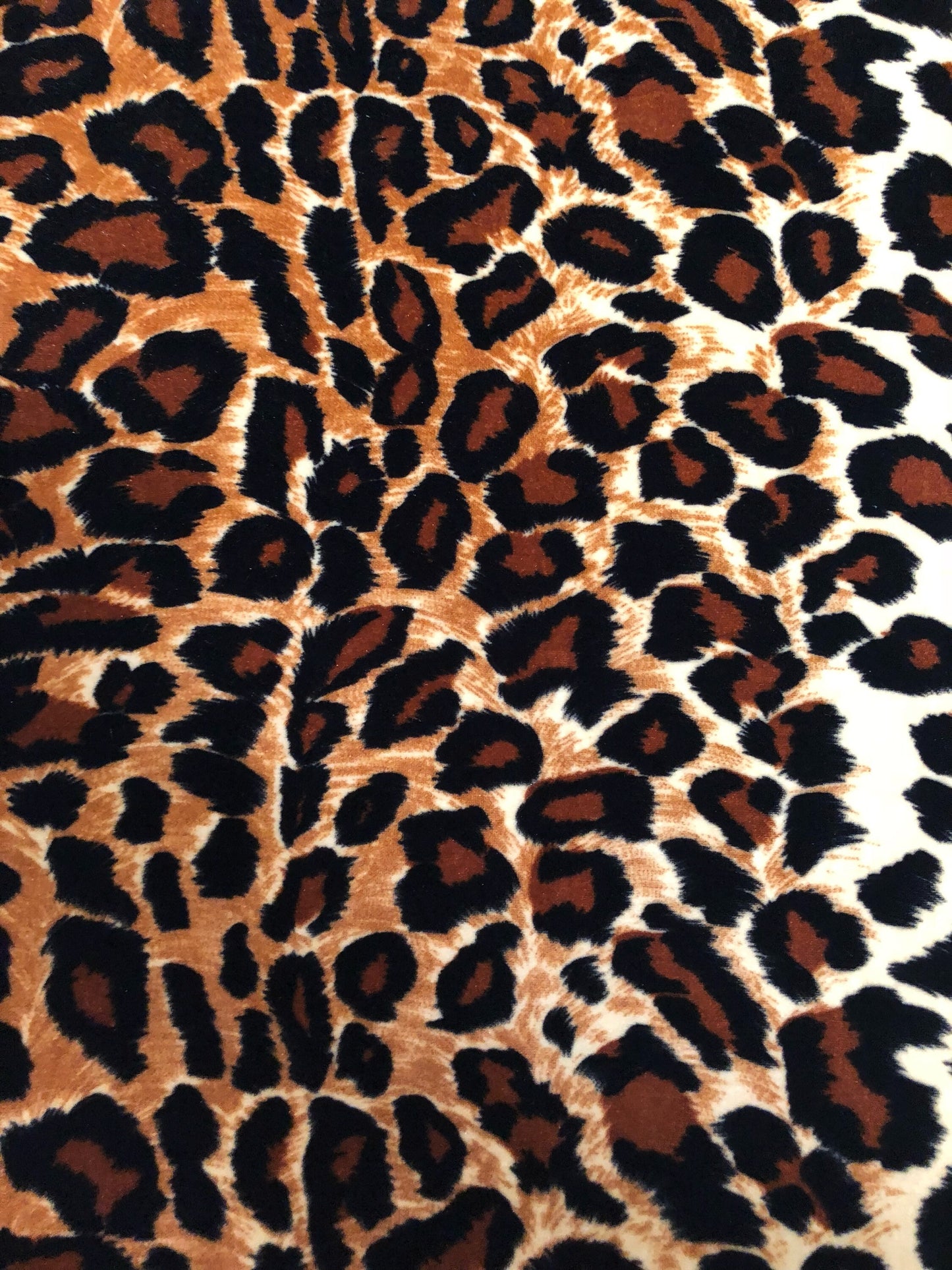 New leopard print Brown/Gold on heavy stretch velvet 4way stretch 58/60" Sold by the YD. Ships worldwide from Los Ángeles California USA.