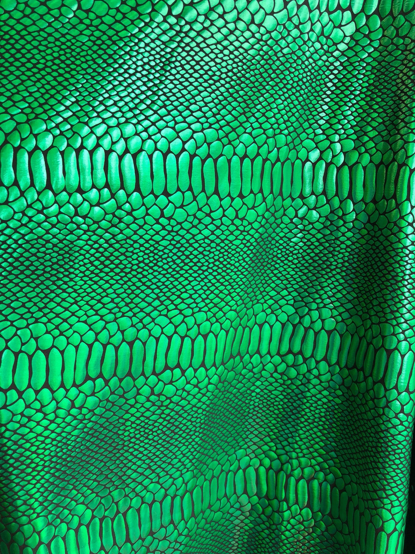 New metallic spandex crocodile design balck/green 4way Stretch 58/60" Sold by the YD. Ships worldwide from Los Angeles California USA.