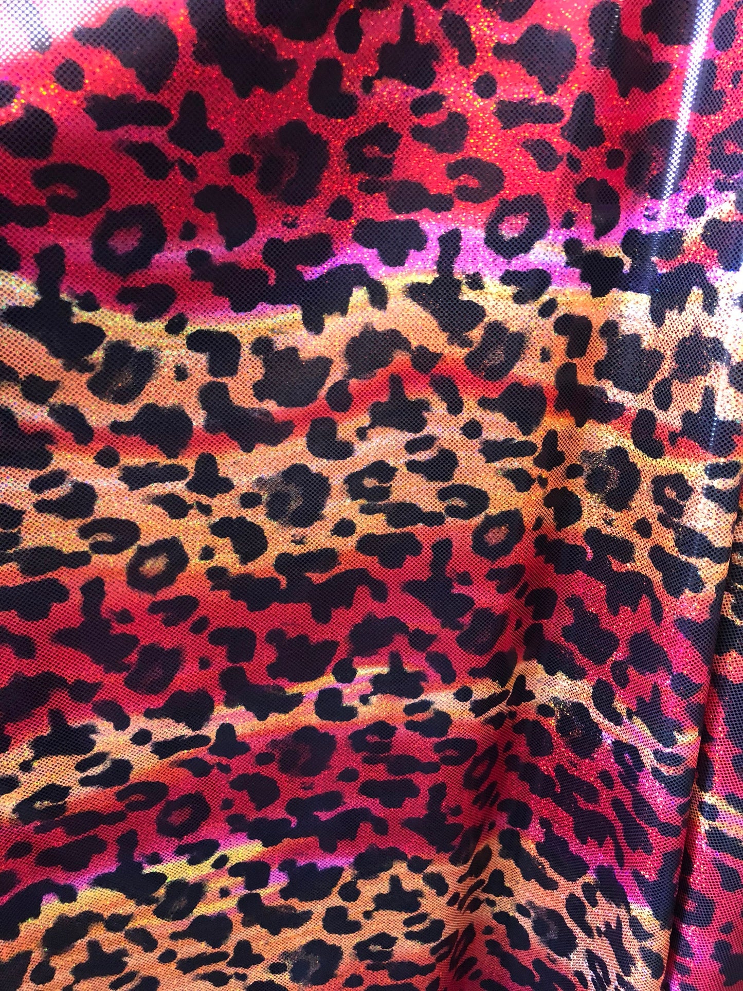 New leopard hologram foil design on nylon spandex 4way Stretch 58/60" Sold by the YD. Ships worldwide from Los Angeles California USA