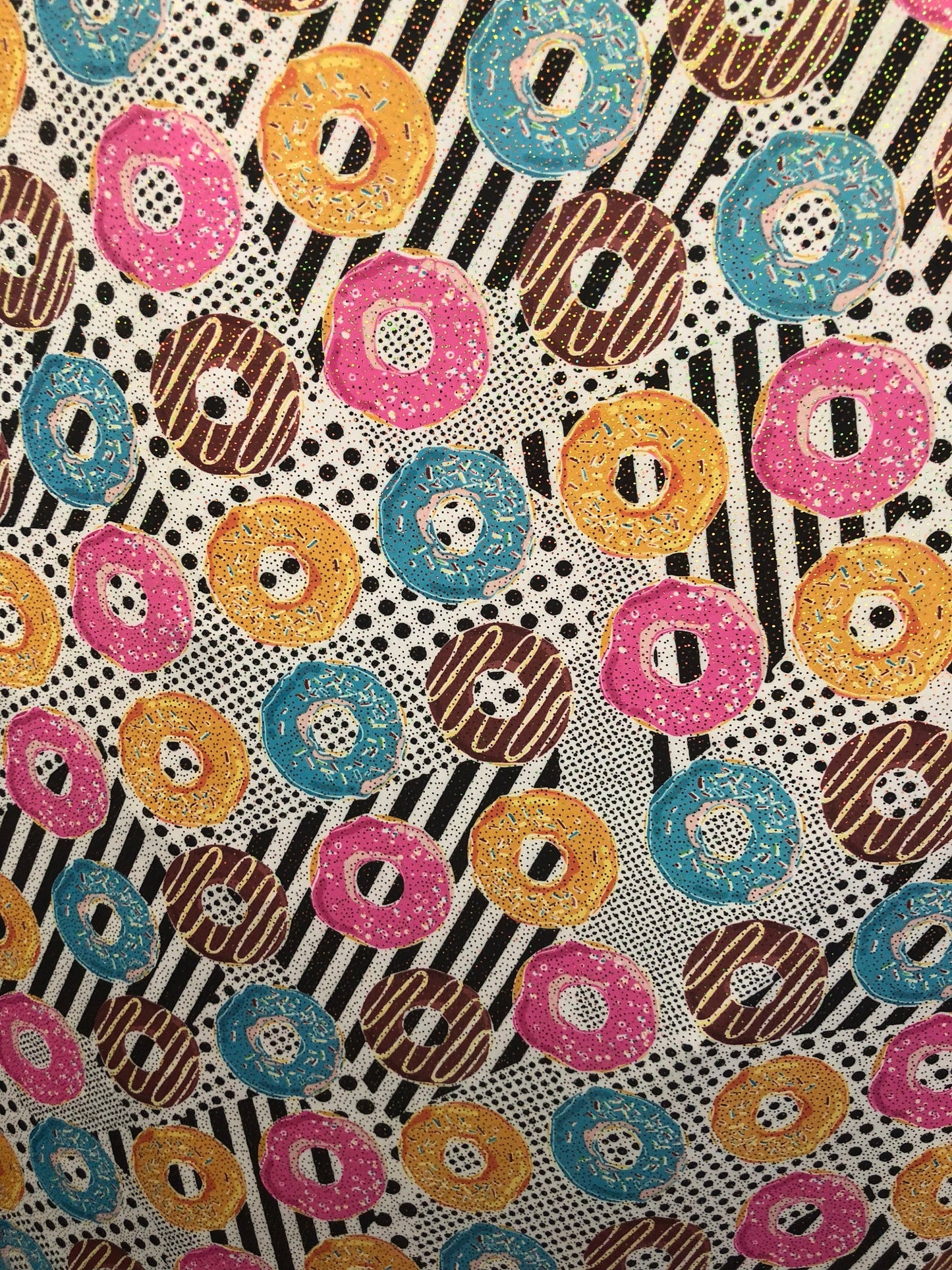 New nylon spandex print with foil all over yum yum donuts design 58/60" Sold by ghe YD. Ships worldwide from Los Angeles California USA.