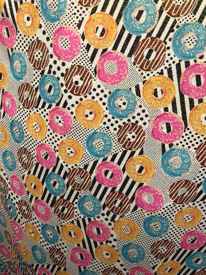 New nylon spandex print with foil all over yum yum donuts design 58/60" Sold by ghe YD. Ships worldwide from Los Angeles California USA.