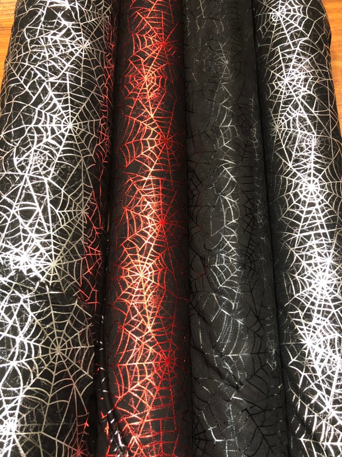 Spider web design with metallic foil on poly mesh 2way stretch 58/60" Sold by the YD. Ships worldwide from Los Angeles California USA.