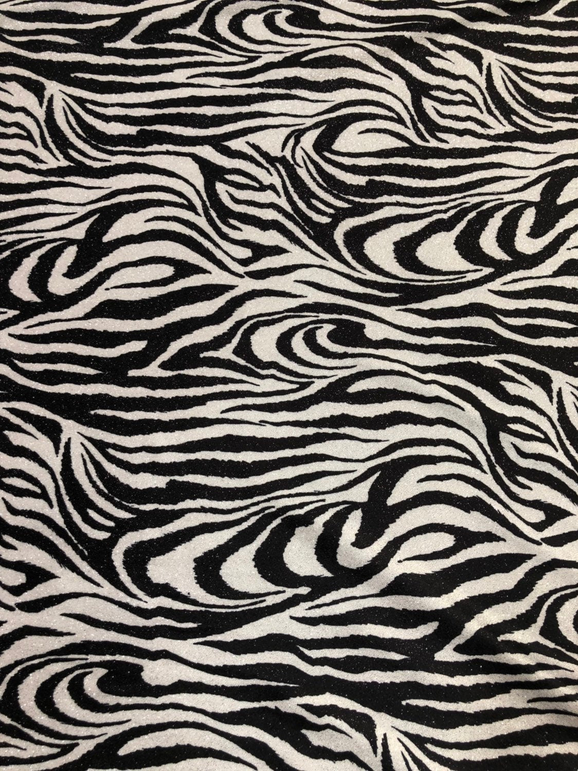 Zebra design  with silver glitter on heavy stretch velvet 4way 58/60" Sold by the YD. Ships worldwide from Los Angeles California USA.