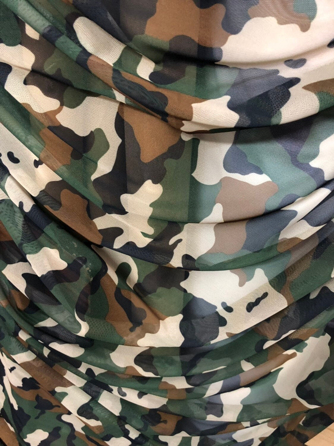 Camouflage design on power mesh 4way stretch 58/60" Sold by the YD. Ships worldwide from Los Angeles California USA.