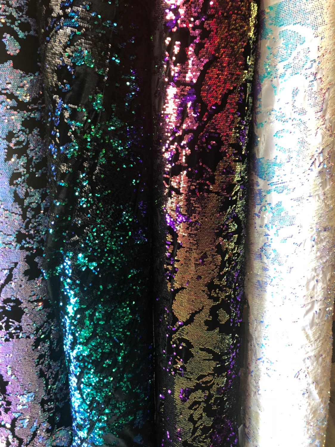 New Iridescent patch sequins on heavy stretch velvet 4way 2tone sequins 58/60" Sold by the YD. Ships worldwide from Los Angeles California.