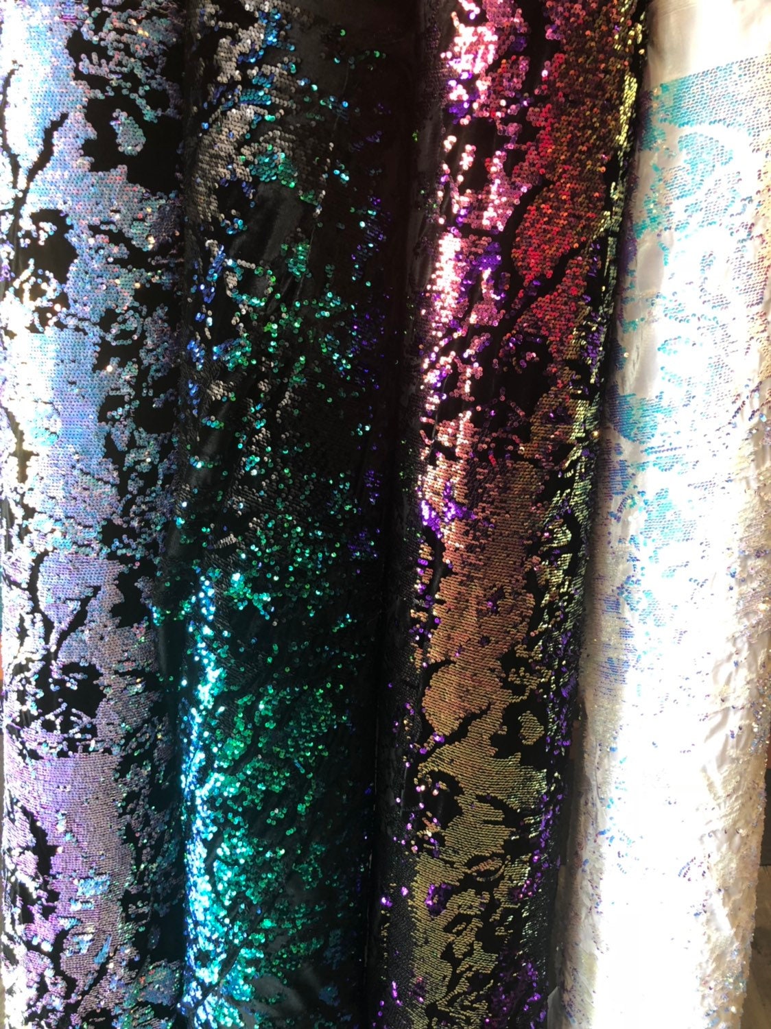 New Iridescent patch sequins on heavy stretch velvet 4way 2tone sequins 58/60" Sold by the YD. Ships worldwide from Los Angeles California.