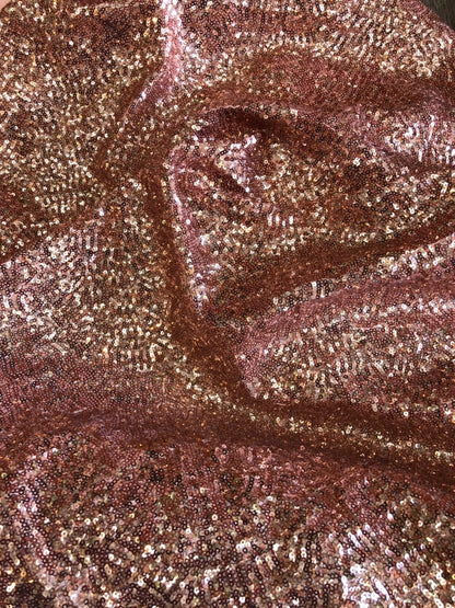 Rose gold mini glitz sequins on heavy spandex 4way stretch 58/60" Sold by the YD. Ships worldwide from Los Angeles California USA.