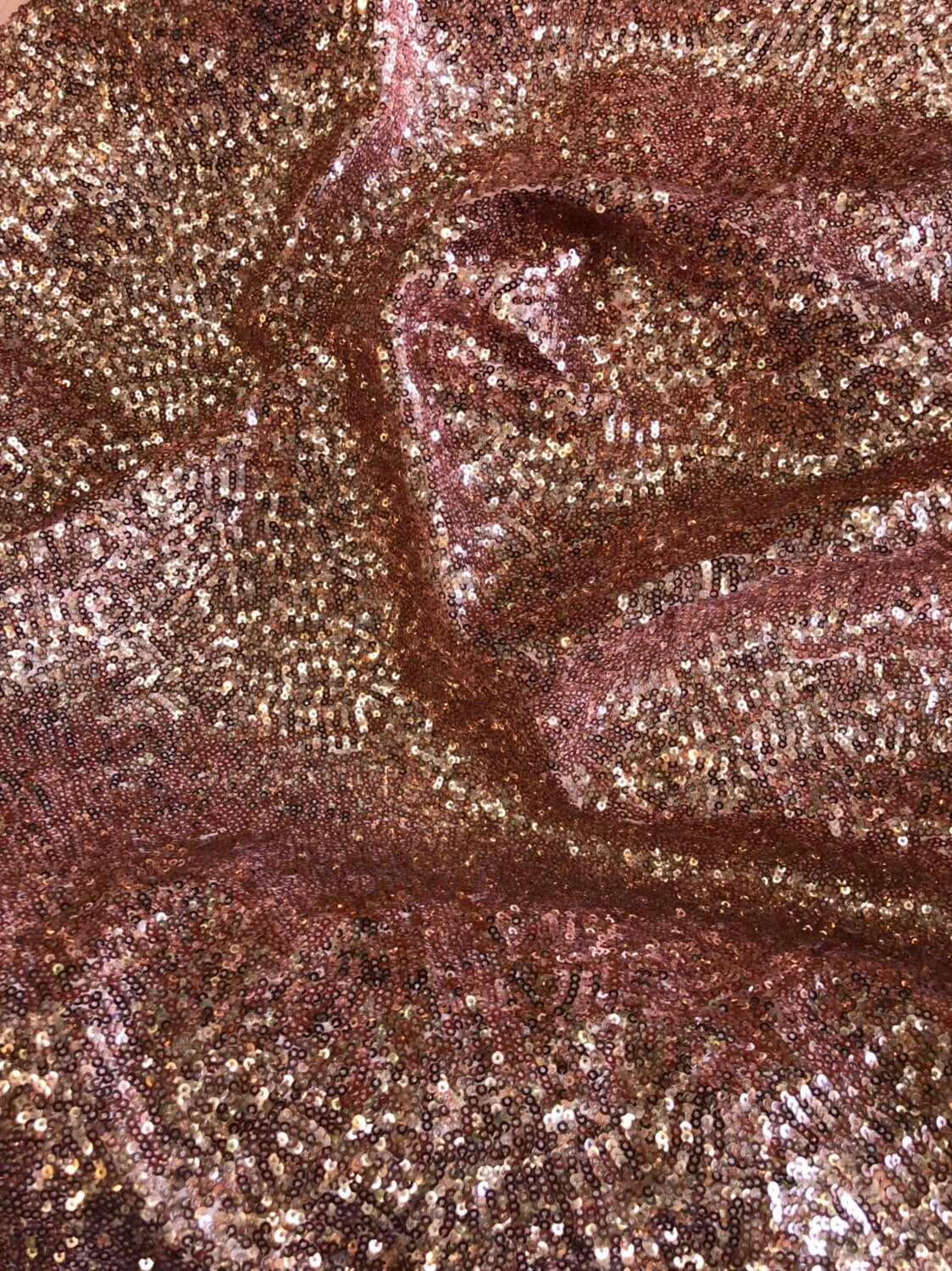 Rose gold mini glitz sequins on heavy spandex 4way stretch 58/60" Sold by the YD. Ships worldwide from Los Angeles California USA.