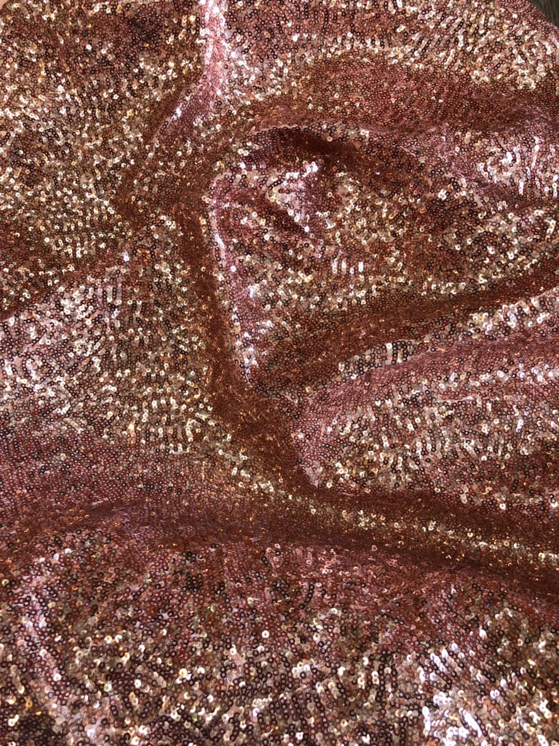 Rose gold mini glitz sequins on heavy spandex 4way stretch 58/60" Sold by the YD. Ships worldwide from Los Angeles California USA.