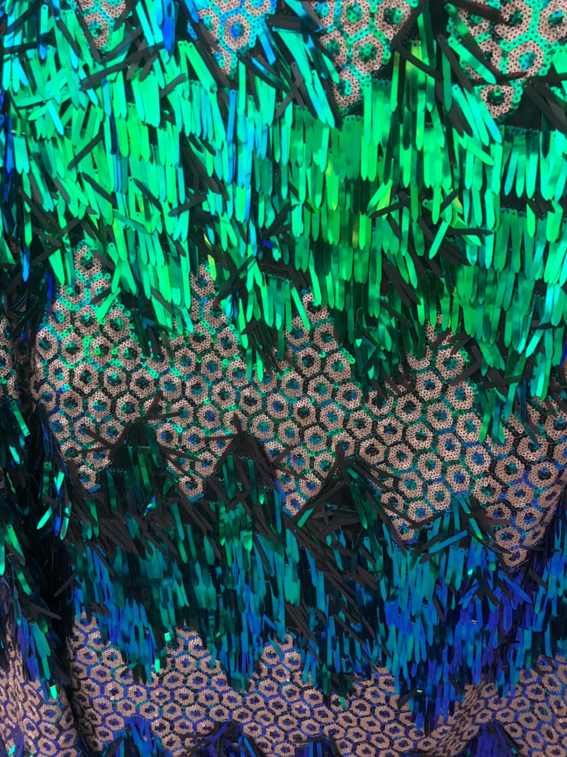 Peacock sequins with hexagon design 2tone sequins on stretch mesh base 2way 55/57" Sold by the YD. Ships worldwide from Los Angeles CA USA.