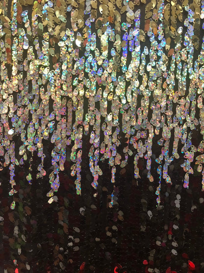 New teardrops sequins multicolor hologram sequins in stretch base 2way 55/56" Sold by the YD. Ships worldwide from Los Angeles CA USA.