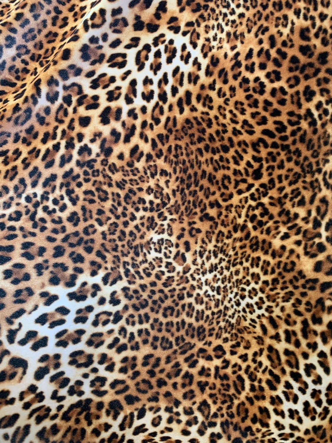 Leopard design print on good quality stretch velvet 4way 58/60" Sold by the YD. Ships worldwide from Los Angeles California USA.