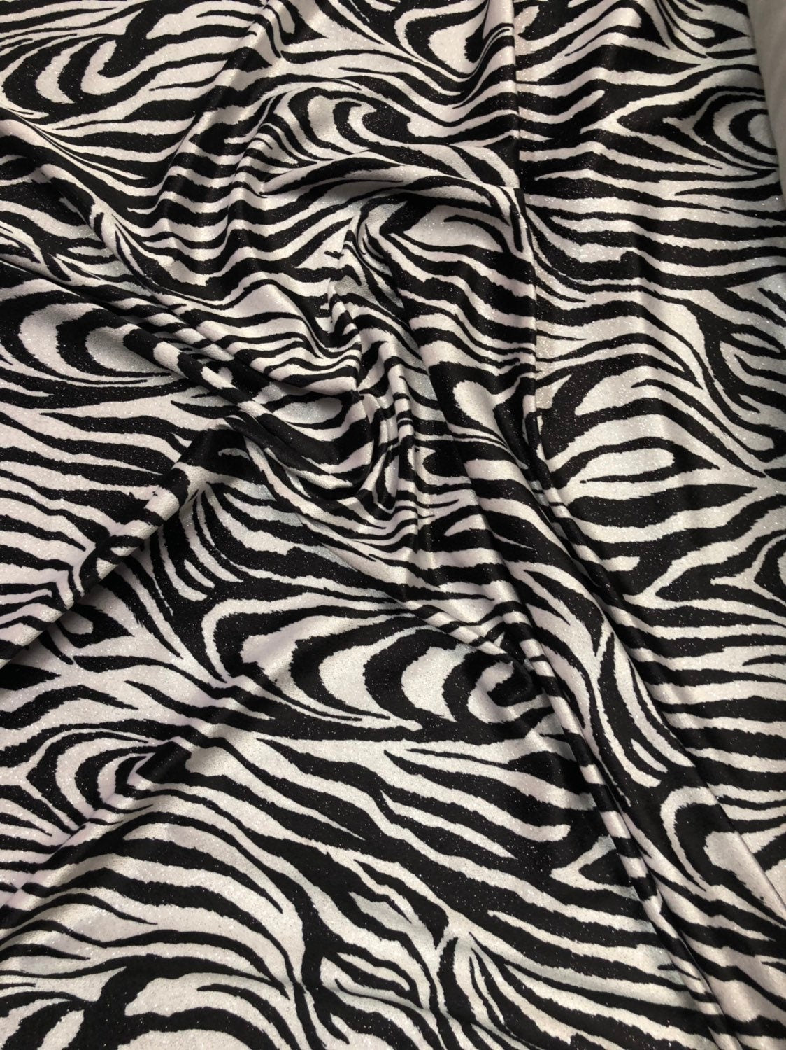 Zebra design  with silver glitter on heavy stretch velvet 4way 58/60" Sold by the YD. Ships worldwide from Los Angeles California USA.