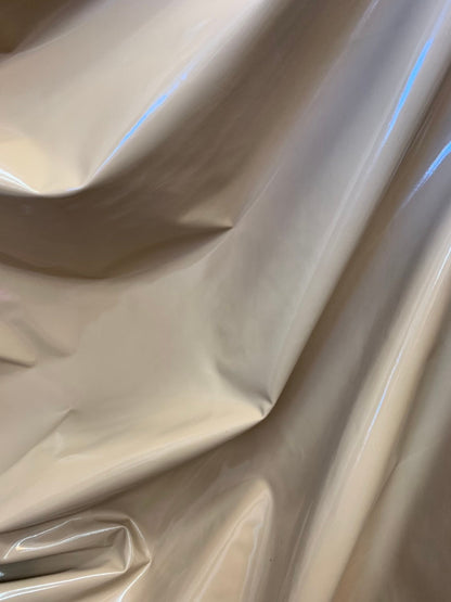 Latex spandex vinyl shining taupe color 4way stretch 58/60" Sold by the YD. Ships worldwide from Los Angeles California USA.