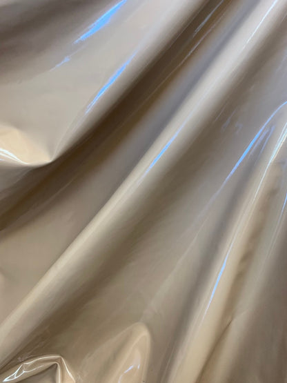 Latex spandex vinyl shining taupe color 4way stretch 58/60" Sold by the YD. Ships worldwide from Los Angeles California USA.