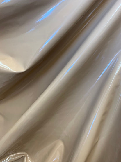 Latex spandex vinyl shining taupe color 4way stretch 58/60" Sold by the YD. Ships worldwide from Los Angeles California USA.