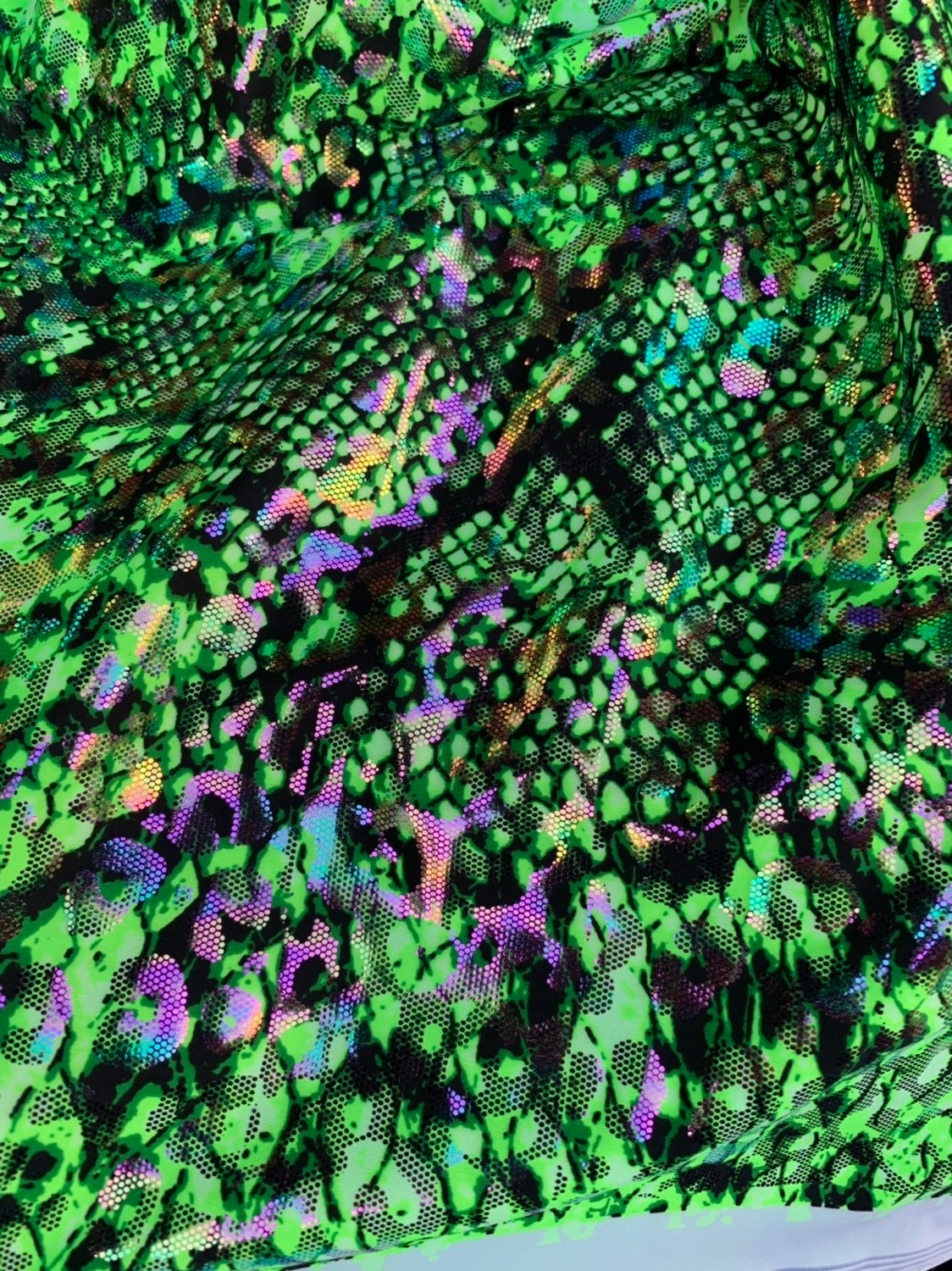 Animal print iridescent snake hologram foil metallic 4way stretch 58/60" Sold by the YD. Ships worldwide from Los Angeles California USA.