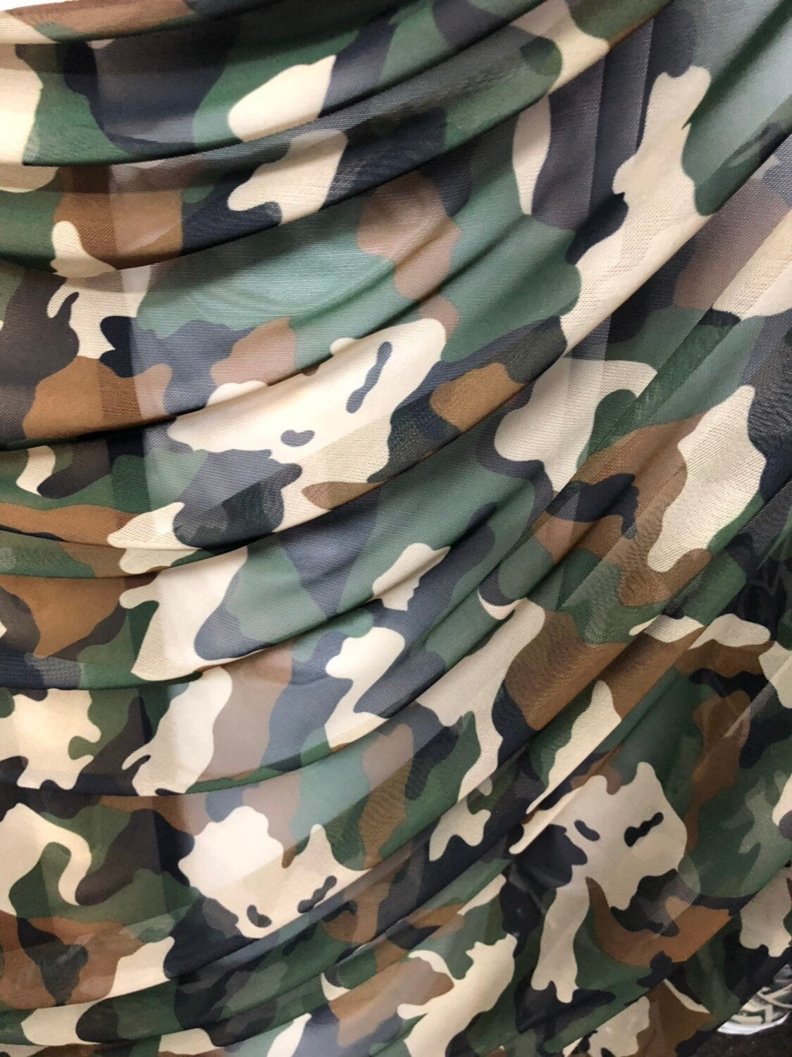 Camouflage design on power mesh 4way stretch 58/60" Sold by the YD. Ships worldwide from Los Angeles California USA.