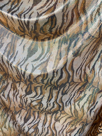 Tiger design metallic hologram nylon spandex 4way stretch 58/60" Sold by the YD. Ships worldwide from Los Angeles California USA.