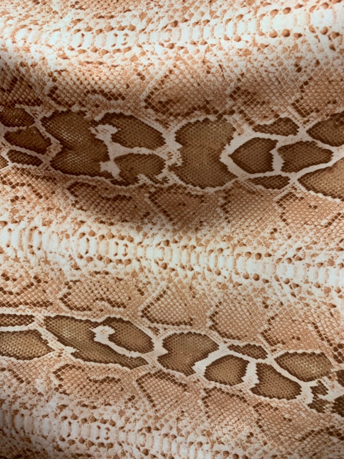 Snake design natural color nylon spandex 4way stretch 58/60" Sold by the YD. Ships worldwide from Los Angeles California.