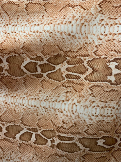 Snake design natural color nylon spandex 4way stretch 58/60" Sold by the YD. Ships worldwide from Los Angeles California.