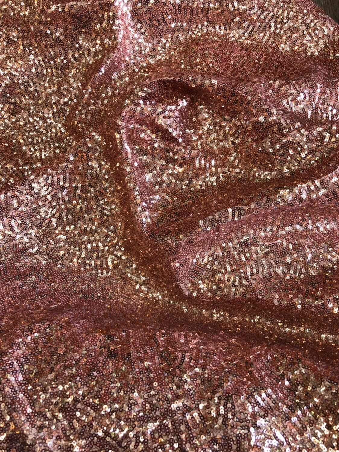 Rose gold mini glitz sequins on heavy spandex 4way stretch 58/60" Sold by the YD. Ships worldwide from Los Angeles California USA.