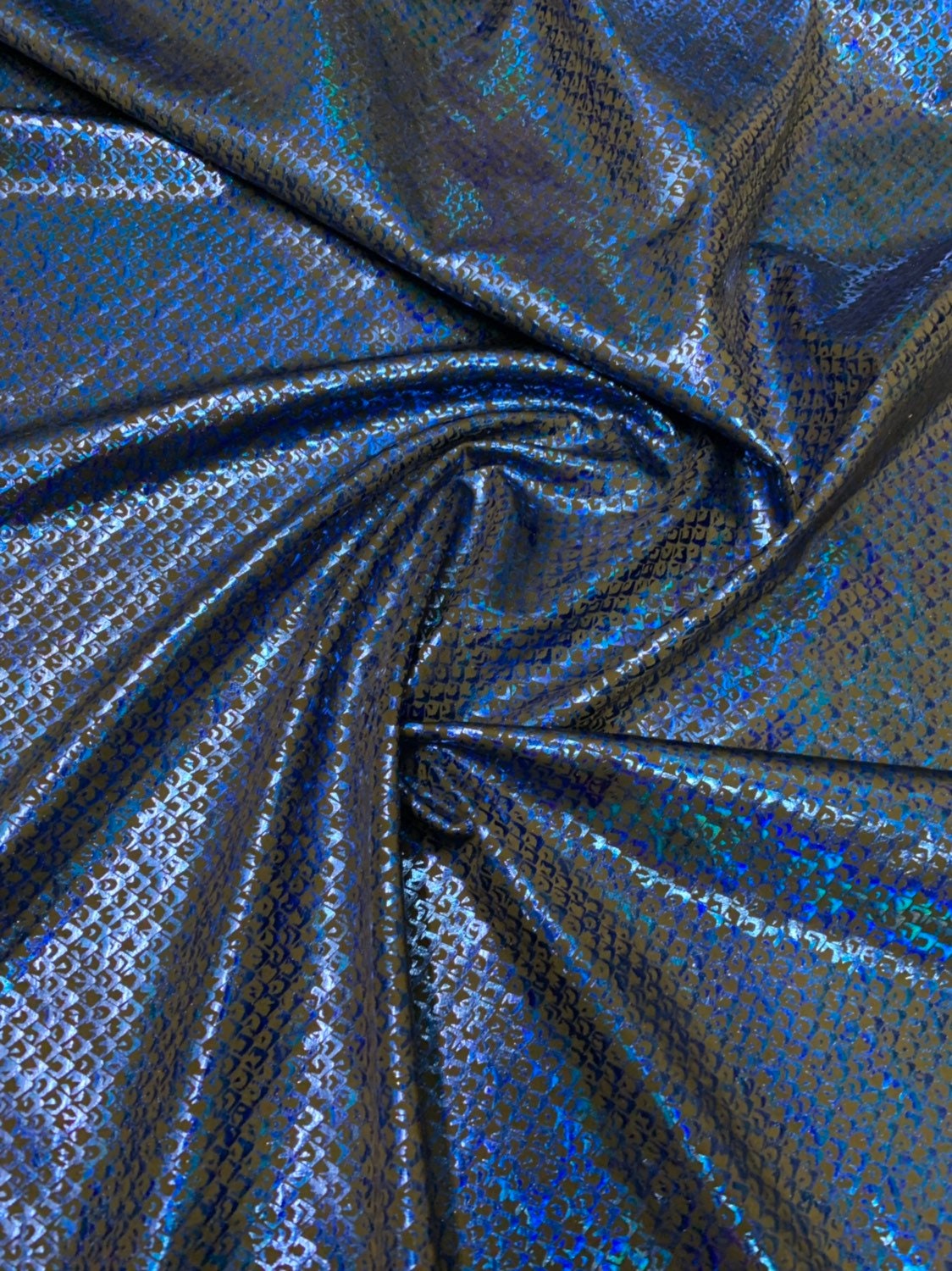 Mermaid scale design small size nylon spandex with hologram foil 4way stretch 58/60" Sold by the YD. Ships worldwide from Los Angeles CA USA