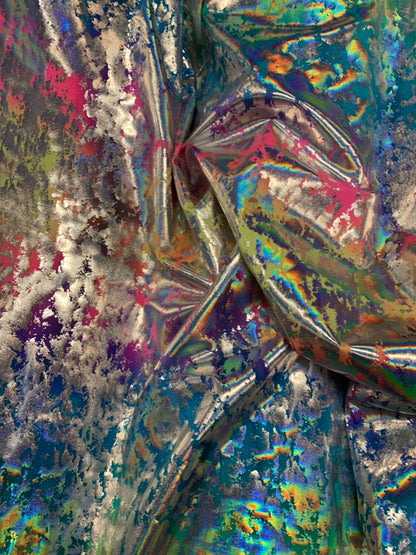 Tie dye splash design metallic iridescent nylon spandex 4way stretch 58/60" Sold by the YD. Ships worldwide from Los Angeles California USA.