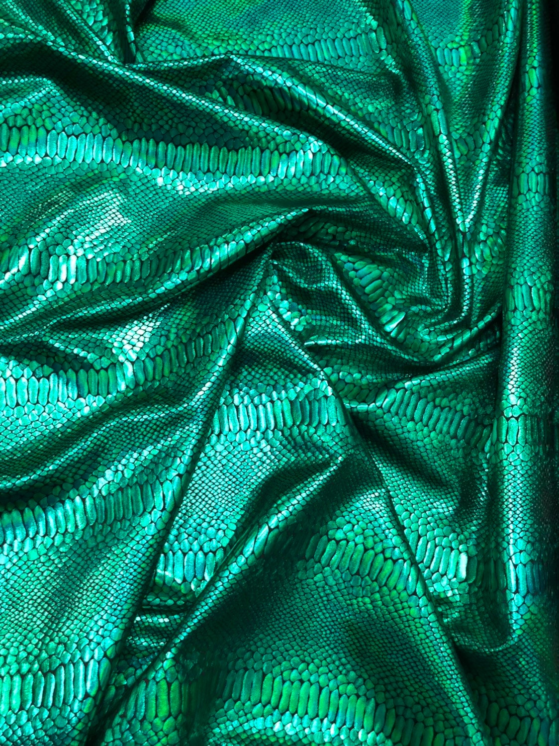 Snake design iridescent green metallic nylon spandex 4way stretch 58/60" Sold by the YD. Ships worldwide from Los Angeles California USA.