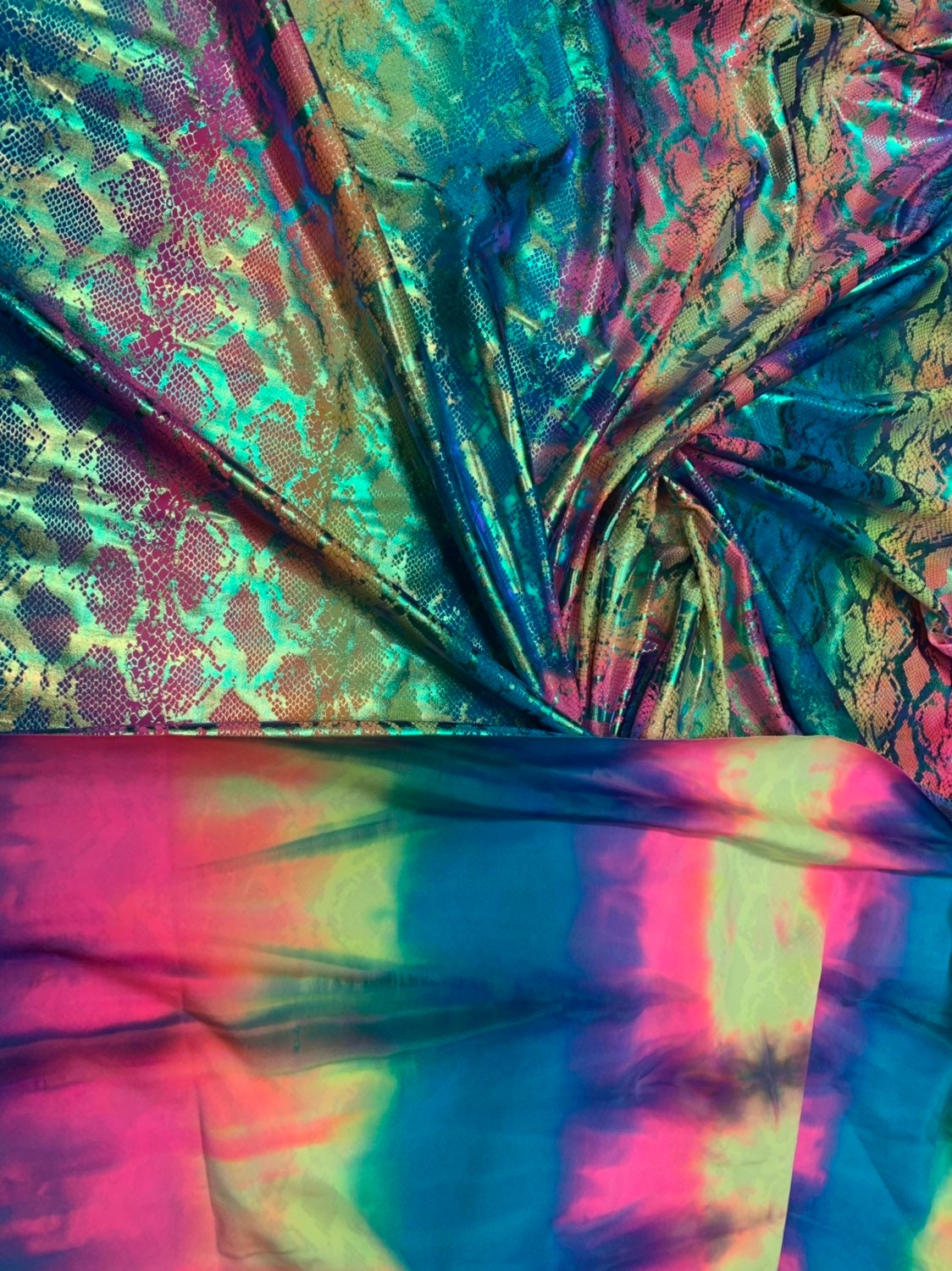 King snake design tie dye metallic nylon spandex with iridescent foil 4way 58/60" Sold by the YD. Ships worldwide from Los Angeles CA USA.