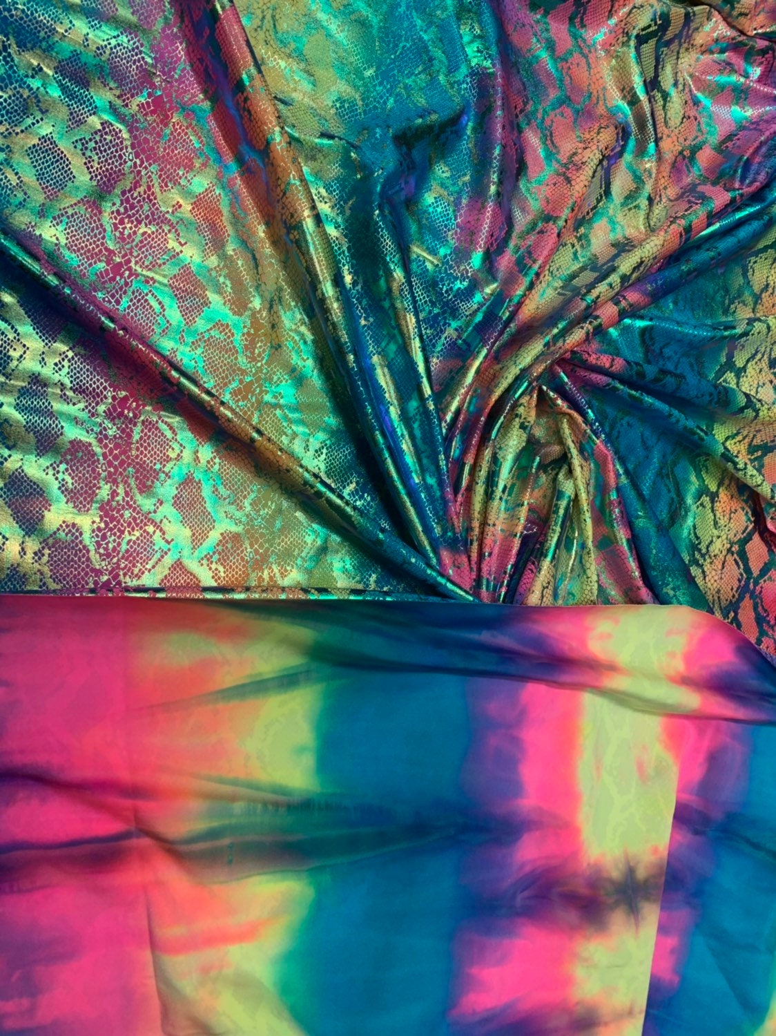 King snake design tie dye metallic nylon spandex with iridescent foil 4way 58/60" Sold by the YD. Ships worldwide from Los Angeles CA USA.