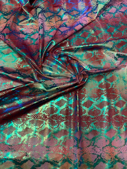 King snake design tie dye metallic nylon spandex with iridescent foil 4way 58/60" Sold by the YD. Ships worldwide from Los Angeles CA USA.