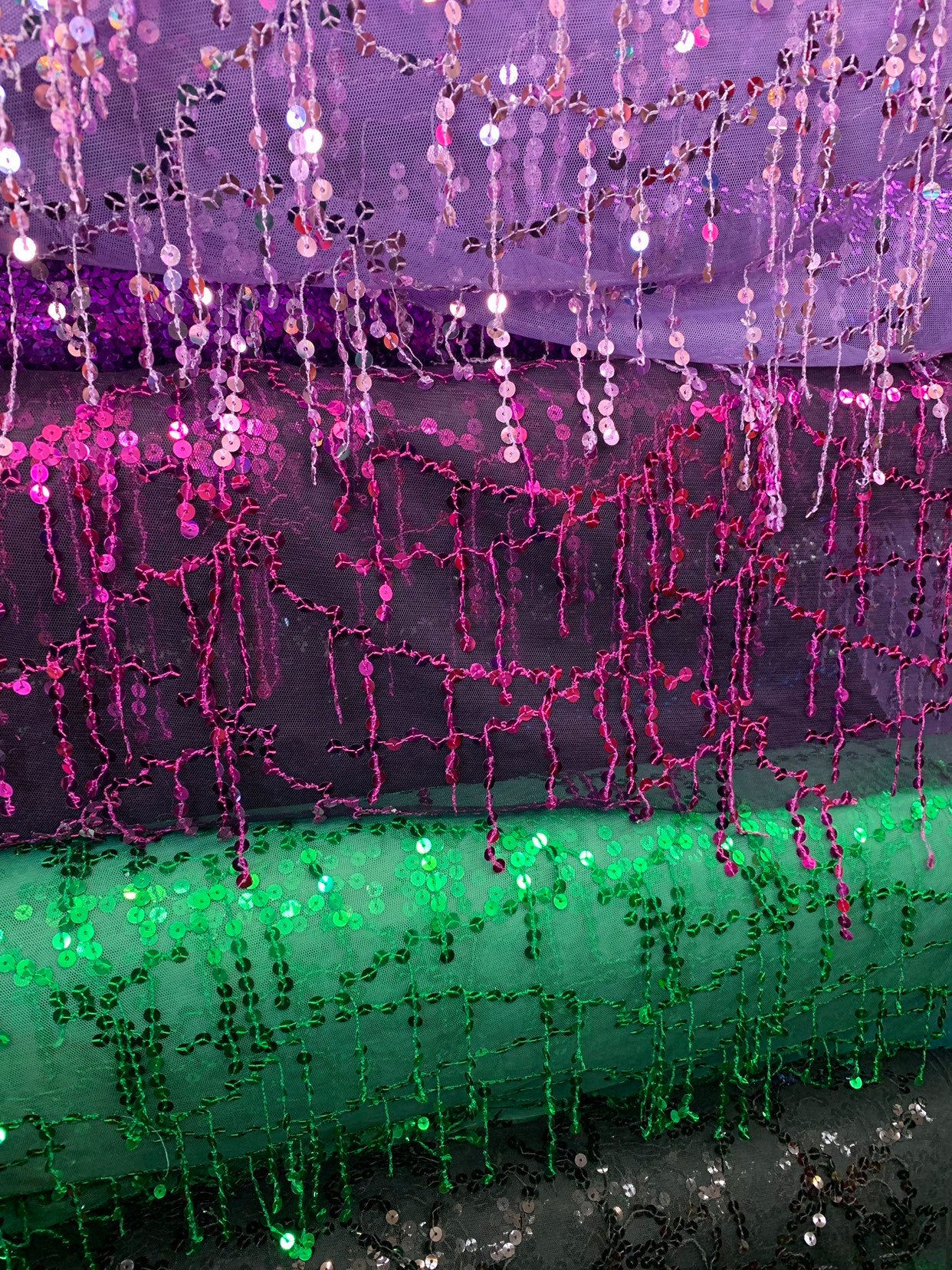 Hanging sequins all over on stretch mesh 2way 55/57" Sold by the YD. Ships worldwide from Los Angeles California USA.