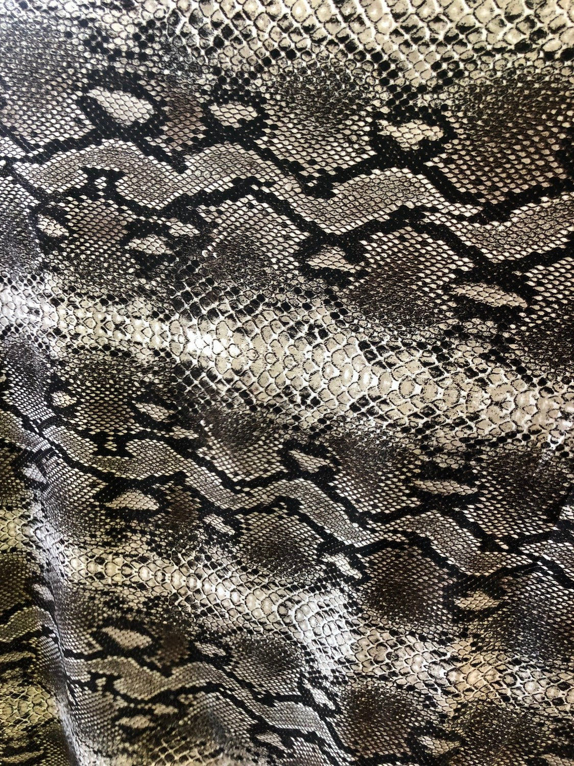 Snake design spandex fabric 2way stretch 58/60" Sold by the YD. Ships worldwide from Los Angeles California USA.