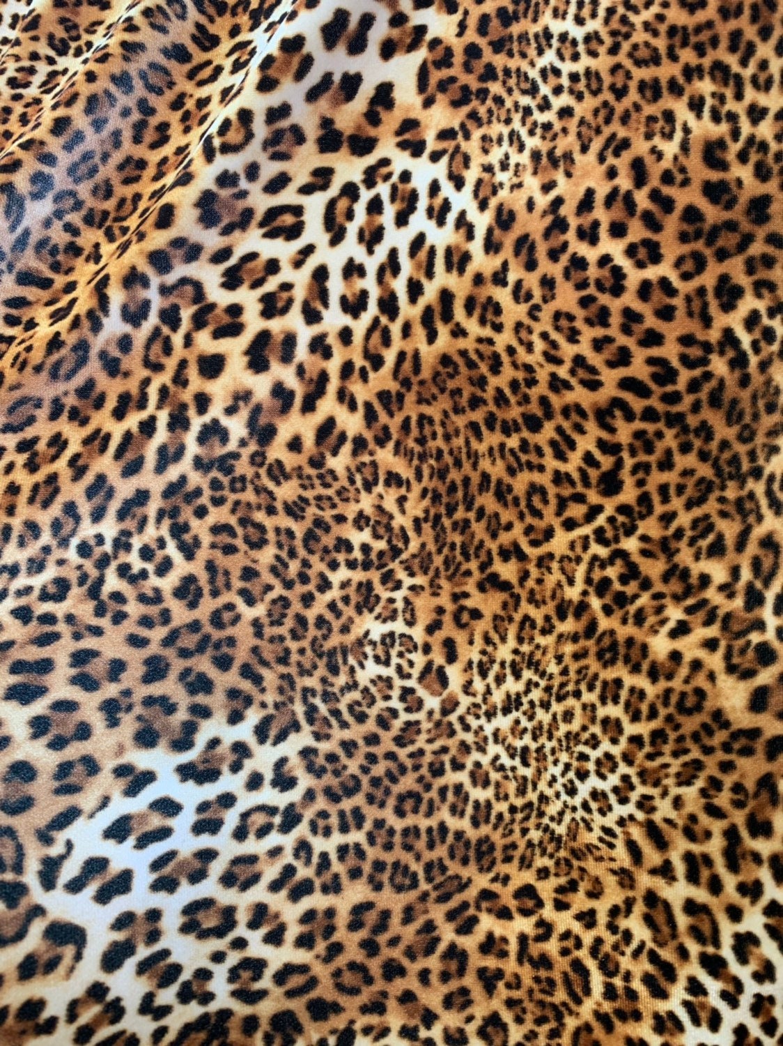 Leopard design print on good quality stretch velvet 4way 58/60" Sold by the YD. Ships worldwide from Los Angeles California USA.