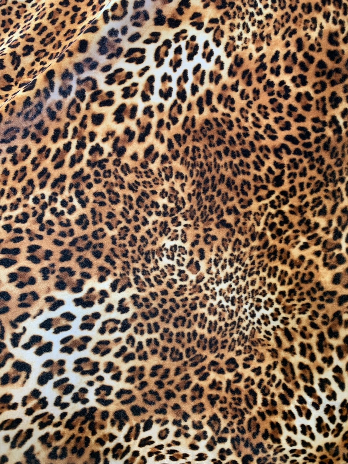 Leopard design print on good quality stretch velvet 4way 58/60" Sold by the YD. Ships worldwide from Los Angeles California USA.