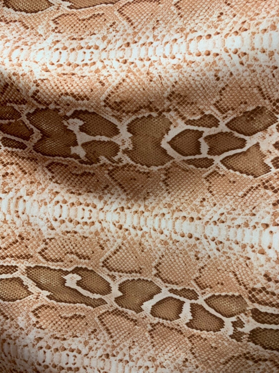 Snake design natural color nylon spandex 4way stretch 58/60" Sold by the YD. Ships worldwide from Los Angeles California.