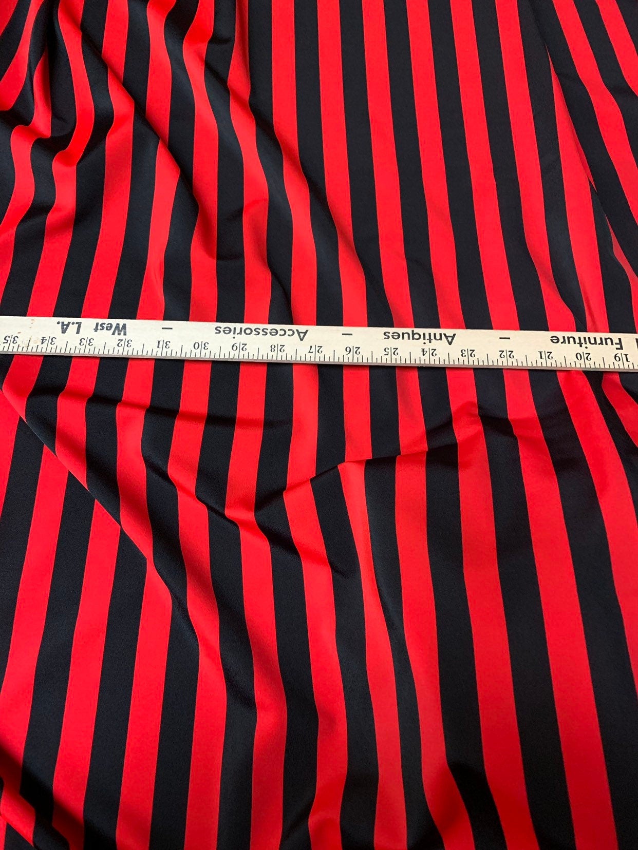 Stripe matte red/black nylon spandex 4way stretch 58/60" Sold by the YD. Ships worldwide from Los Angeles California USA.