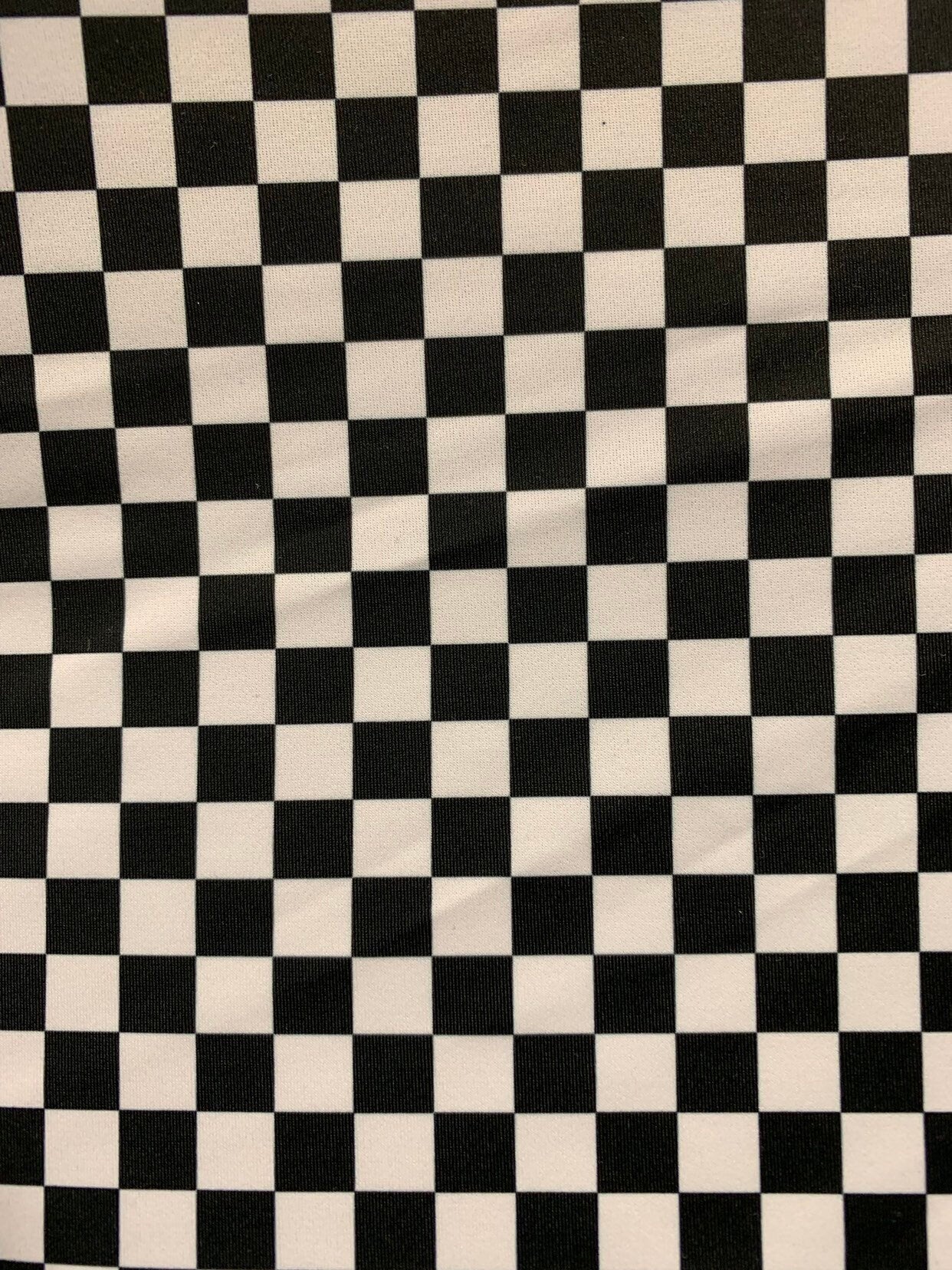 New small checkered design size 1/2 inch nylon spandex 4way stretch 58/60" Sold by the YD. Ships worldwide from Los Angeles California USA.