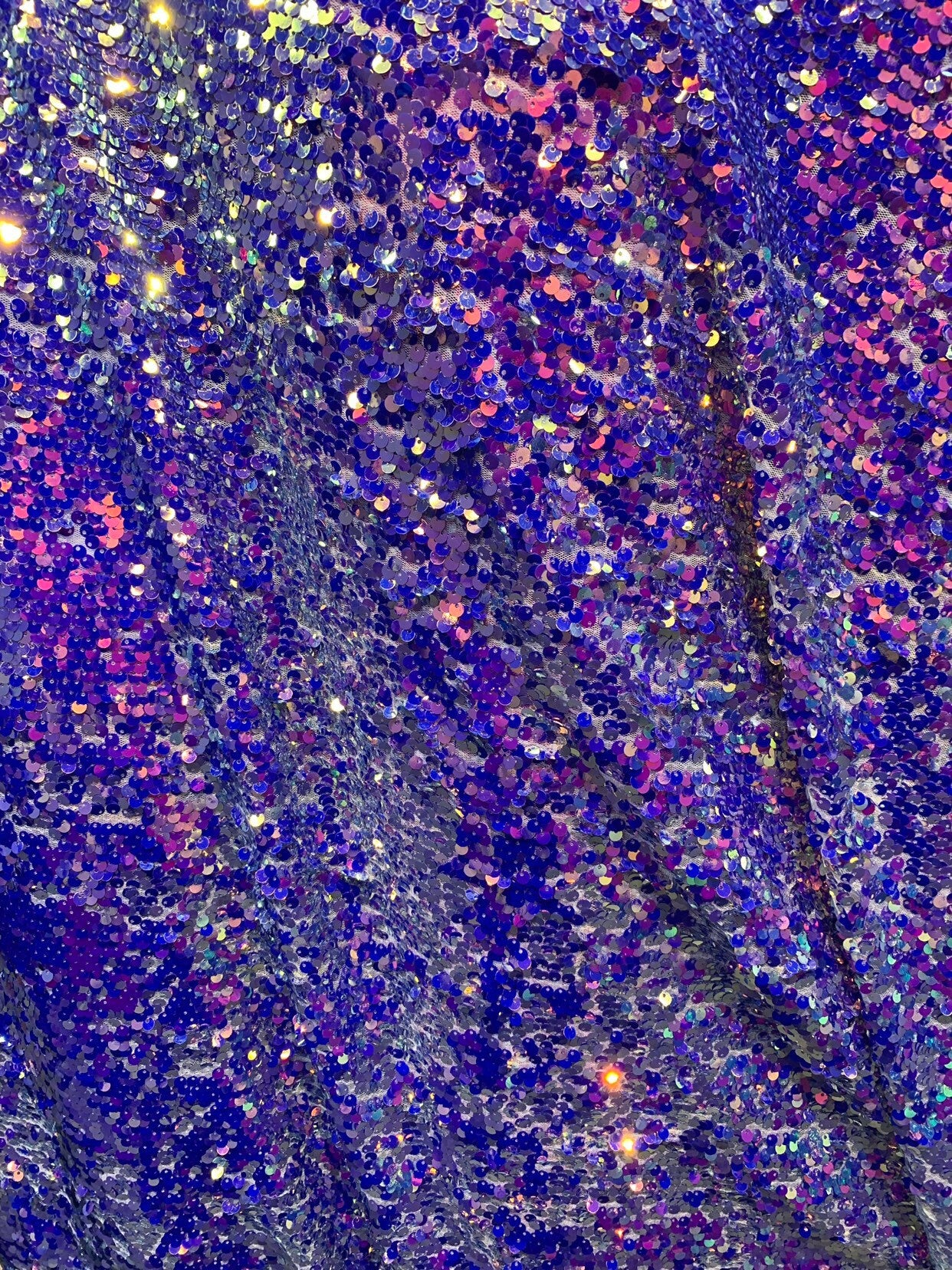 New hologram iridescent sequins rain drop sequins on stretch mesh 4way 55/57" Sold by the YD. Ships worldwide from Los Angeles California US