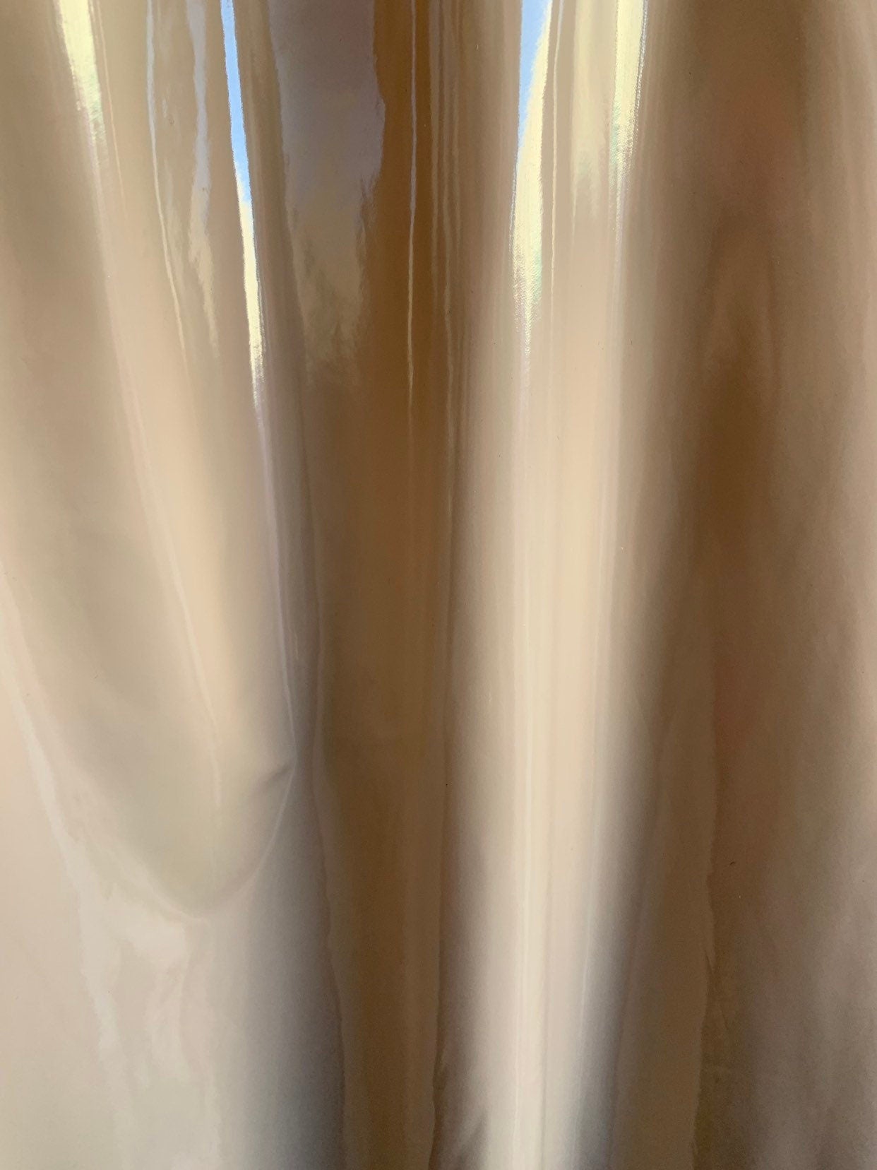 Shiny taupe Latex nylon spandex 4way stretch 58/60" Sold by the YD. Ships worldwide from Los Angeles California USA.