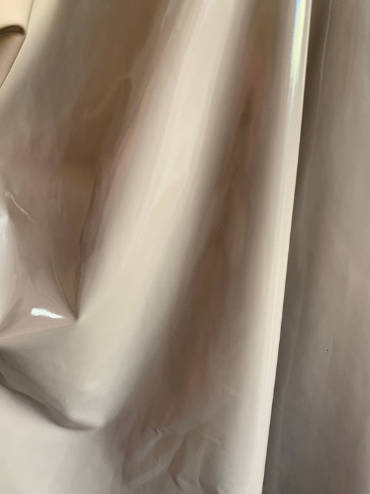 Shiny taupe Latex nylon spandex 4way stretch 58/60" Sold by the YD. Ships worldwide from Los Angeles California USA.