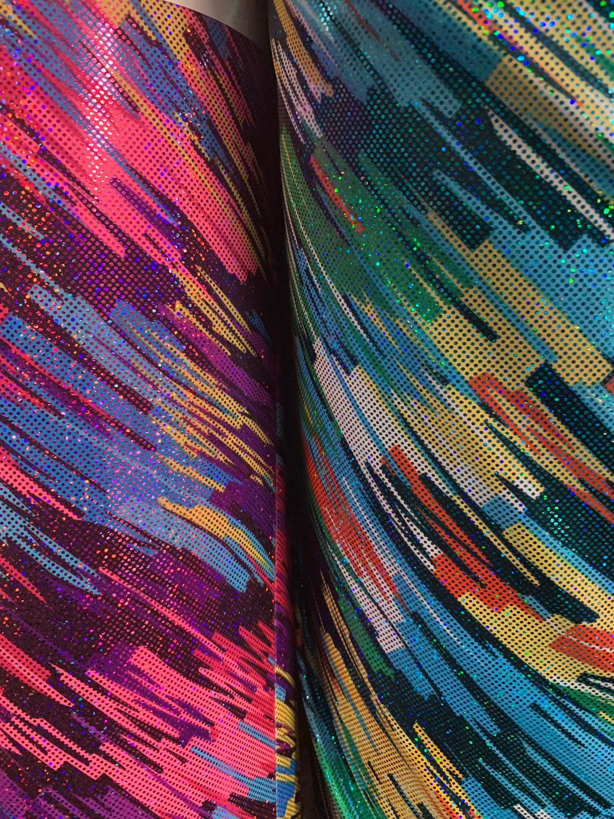 Swing swing design hologram metallic nylon spandex 4way stretch 58/60" Sold by the YD. Ships worldwide from Los Angeles California USA.