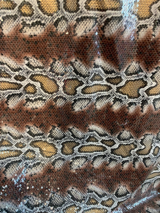 Snake design brown/gold with clear sequins all over spandex base 2way 58/60" Sold by the YD. Ships worldwide from Los Ángeles California USA