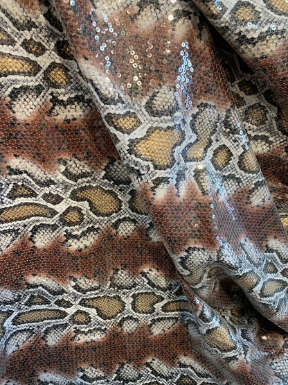 Snake design brown/gold with clear sequins all over spandex base 2way 58/60" Sold by the YD. Ships worldwide from Los Ángeles California USA